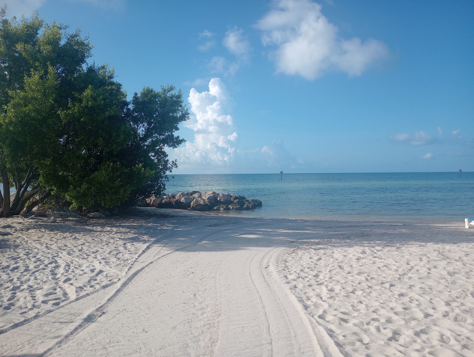 White sand beach and turquoise water in Key West under a blue sky